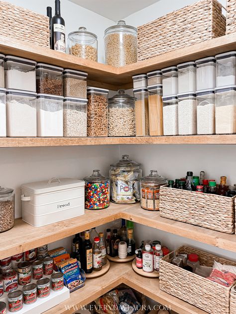 Corner pantry, pantry with black glass door, organized pantry, pantry with wood stained shelves, baskets inside pantry, space saving pantry ideas Open Shelving Walk In Pantry, Open Face Pantry, Walk In Corner Pantry Ideas Layout, L Shape Pantry Organization, Pantry L Shaped Shelves, Pantry Shelving Dimensions, Corner Pantry Organization Ideas Walk In, Appliance Shelf In Pantry, Corner Pantry Makeover Diy