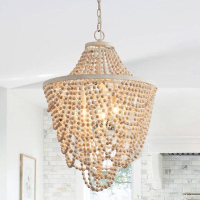 This 3-light chandelier has an eclectic, romantic-coastal look that elevates it to statement-making status. This fixture strikes an empire silhouette with wood-beaded accents for a boho touch and hangs from an adjustable chain. The beaded curtains give this fixture just the right farmhouse look. Inside, three candelabra-base bulbs of up to 40W (sold separately) brighten up your spaces. The living room, bathroom, and hallway are some of the ideal spaces where the beaded chandelier can shine! Even Modern Farmhouse Transitional, Classic Bungalow, Coastal Chandelier, Farmhouse Transitional, Wood Bead Chandelier, Foyer Chandelier, Empire Chandelier, Beautiful Farmhouse, Room Chandelier