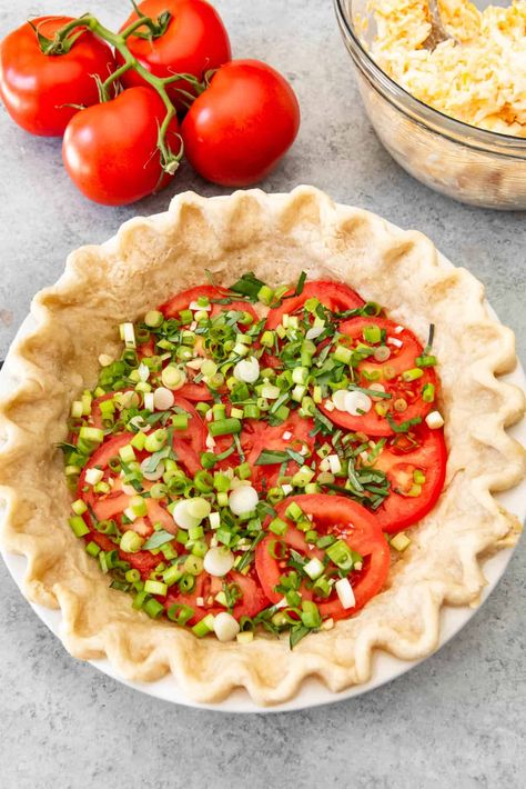 This savory Southern Tomato Pie is made with summer-ripe tomatoes, fresh basil leaves, and topped with a tasty cheese & mayo topping!  #tomatoes #garden #summer #pie #southern #easy #homemade #piecrust #fromscratch #cheesy #cheese #mayo #mayonnaise #recipe #dinner #lunch #sidedish Tomato Pie Recipe Easy, Best Tomato Pie, Tomatoes Garden, Southern Tomato Pie, Tomato Pie Recipe, Yummy Veggies, Tomato Dishes, Vegetable Pie, Summer Pie