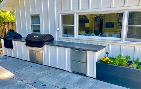 Includes gas grill, smoker and drawer fridge. Outdoor Kitchen Board And Batten, Hardie Board Outdoor Kitchen, Outdoor Kitchen Hardie Board, Kitchen With Stone, Farmhouse Outdoor Kitchen, Simple Outdoor Kitchen, Tile Countertops Kitchen, Garden Board, Stella Rose