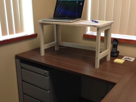 Collapsible Desktop Riser (convert desk to standing desk) by Adam Famulary — Kickstarter.  This sturdy desktop riser folds up so you can place it out of sight when not in use (such as when a client is in your office). Desktop Riser, Elevated Desk, Standing Desk Riser, Office Cube, Diy Standing Desk, Diy Tables, Desk Hacks, Pipe Desk, Desk Riser