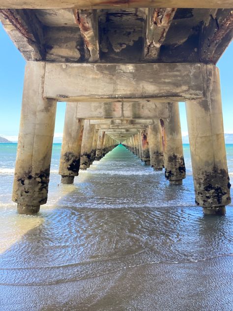 picture taken underneath a pier in the ocean Gisborne New Zealand, New Zealand Nature, North Island New Zealand, Water Ocean, New Zealand Travel, Beach Summer, Ocean Beach, Free Art, Blue Water