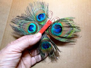 Make it easy crafts: Peacock feather butterfly ornament Peacock Feather Decor, Peacock Christmas Tree, Feather Butterfly, Peacock Crafts, Easy Ornaments, Peacock Christmas, Feather Diy, Peacock Butterfly, Butterfly Ornaments