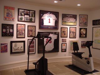 Visions of his Man Cave! Gallery Wall Sports, Sports Gallery Wall, Baseball Office, Sports Memorabilia Room, Sports Pictures Display, Sports Memorabilia Display, Sports Cave, Memorabilia Wall, Picture Display Wall