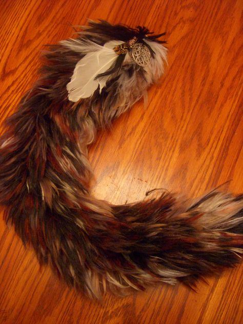 A Faux tail made entirely out of yarn! This one has a feather and celtic charm.    *Tail commissions are available! Contact Tailwinds Therian Tail Ideas, Therian Tail, Tail Ideas, Tail Designs, Therian Gear, Wolf Tail, Therian Stuff, Wet Specimen, Fursuit Head