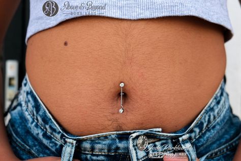 The best part of seeing a healed piercing we did is getting to add even more sparkles to it! 💫💎💫 This client came in sporting a happy and healed Floating Navel done by Josh and was looking to add a dangly charm! We custom made this titanium chain to fit onto their existing @anatometalinc curve, and topped it off with a matching White CZ charm from @industrialstrength ! Keep up with the summer fun by getting yourself a new piece for your healed piercing 😍 📷: @50percentsnakes . . . #safepie... Floating Navel, Healed Piercing, Navel Piercing, Above And Beyond, Keep Up, Body Jewelry, Summer Fun, Piercings, Custom Made