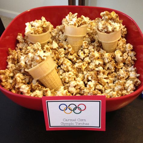 Carmel Corn Torches - Olympics party French Themed Olympic Party, Olympic Dinner Party, Olympics Watch Party Ideas, Olympics Party Theme, Olympics Watch Party, Olympic Opening Ceremony Party Ideas, Paris Olympics Party, Olympic Food Ideas, Olympic Themed Snacks