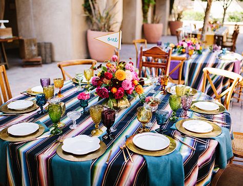 Our fiesta inspired wedding was just as vibrant as it was fun! With  bright beautiful blooms, Mexican serape style linens, and colorful glassware you get this lively celebration just featured on #inspiredbythis! Mexican Themed Weddings, Mexican Colors, Mexican Fiesta Party, Mexican Serapes, Fiesta Wedding, Mexican Party Theme, Boda Mexicana, Colored Glassware, Mexican Decor