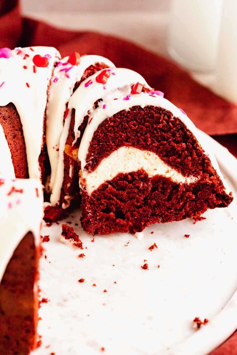 This red velvet bundt cake is soft, fluffy, and swirled with an easy cream cheese filling. It’s topped with a cream cheese glaze and sprinkles. This bundt cake has such a beautiful surprise when you cut into it! Easy Cream Cheese Filling, Red Velvet Bundt, Red Velvet Bundt Cake, Cream Cheese Swirl, Swirl Cake, Make Cream Cheese, Cream Cheese Glaze, Easy Cream, Bundt Cakes Recipes