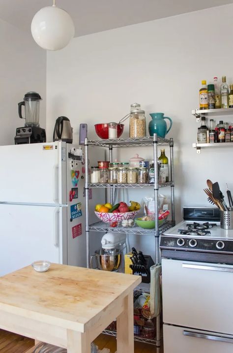 The Wire Shelving Unit That Solved My Small Kitchen Storage Woes | Apartment Therapy Kitchen Island For Studio Apartment, Small Kitchen Ideas Shelves, No Kitchen Storage Solutions, Kitchen In Studio Apartment, Slim Storage Ideas, Kitchen Organization Small Space, Kitchen No Pantry Storage Ideas, Kitchen Metal Rack Storage Ideas, Rental Kitchen Storage