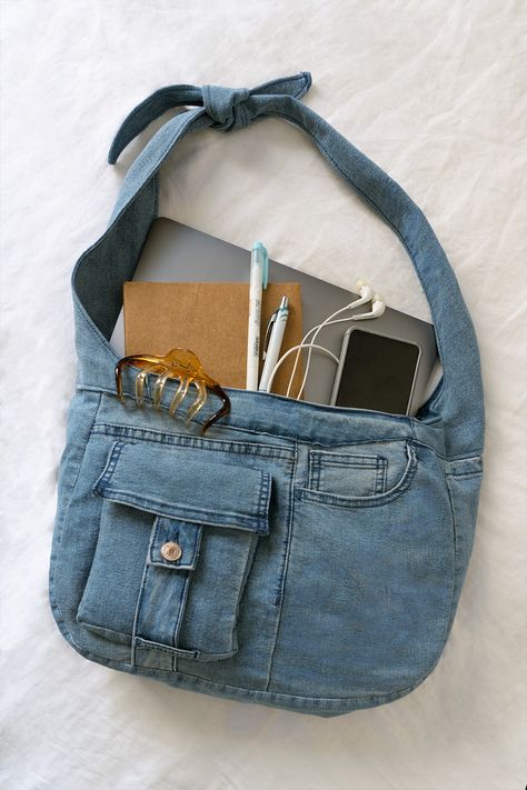 flatlay of denim bag with school supplies: laptop, notebook, stationery, phone and wired earphones How To Sew A Bag From Old Jeans, Denim Bags Diy Recycling Old Jeans, Denim Sewing Ideas, Denim Thrift Flip, Jean Sewing Projects, Jean Tote Bag Diy, Upcycled Denim Bag, Handmade Bags Diy Old Jeans, Jean Bag Diy