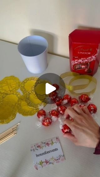 Rubbia on Instagram: "Chocolate Wedding Favours 

#chocolate #fyp #wedding #birthday #party #shadi #favours #treats #giveaways #instalike #instareels #byrubbia #lindt #lindor #paperdoilies #chocolates #chocolatetreats #weddingseason #ideas #gifts #howto #asmr #foryou" Lindor Chocolate Bouquet, Lindt Chocolate Gift Ideas Diy, Lindt Gift Ideas, Lindt Chocolate Ball Wreath, Lindt Chocolate Wreaths, Lindt Chocolate Gift Ideas Christmas, Rolo Christmas Treats, Lindor Chocolate Gift Ideas, Lindt Bouquet