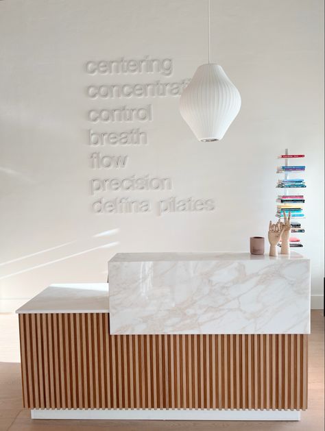 Yoga Studio Reception Desk, Pilates Reception Area, Pilates Studio Inspiration, Pilates Studio Design Interiors Mirror, White Pilates Studio, Pilates Boutique Studio, Dance Studio Front Desk, Yoga Studio Signage, Pilates Design Studio