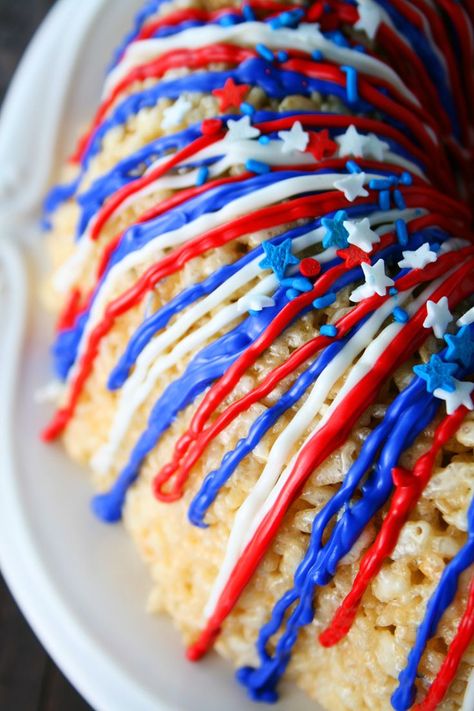 Rice Krispies Treats are pressed into a Bundt cake pan to form this Patriotic Rice Krispies Cake with red, white and blue candy melts drizzled on top. Recipes on MomLovesBaking.com #cake #fourthofjuly Rice Krispies Cake, Rice Krispie Cakes, Patriotic Desserts, July Recipes, Krispy Treats, Bundt Cake Pan, Rice Krispy, Rice Krispie Treats, Rice Krispie