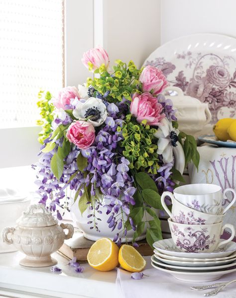 Tips for Flower Arrangements with Wisteria - Victoria Magazine #BridalShowers #BridalFlowers #GardenWeddings #Bouquets Wisteria Centerpiece, Colorful Flowers Arrangements, Framed Flower Art, Victoria Magazine, Country Lane, Bluish Purple, Artificial Floral Arrangements, Elegant Centerpieces, Pressed Flower Art