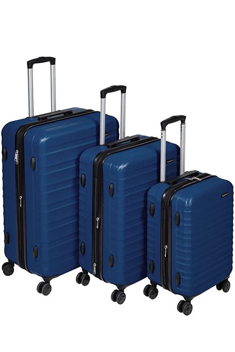 Hardside spinner luggage for work travel, vacations, or as international carry-on. Includes 3 spinners (21-, 26-, and 30-inch) with a protective extra-thick ABS hard shell and scratch resistant navy blue finish. 4 double spinner wheels ensure smooth-rolling mobility in any direction. Sturdy telescoping handle and a securely mounted short handle Product dimensions: 10 x 14.9 x 22 inches, 11.4 x 18.3 x 26.7 inches, and 12.7 x 21 x 30.7 inches (LxWxH, including wheels). Hardside Luggage Sets, 3 Piece Luggage Set, Hardside Spinner Luggage, Hardside Luggage, Amazon Basics, Amazon Store, Suitcase Traveling, Luggage Sets, Work Travel