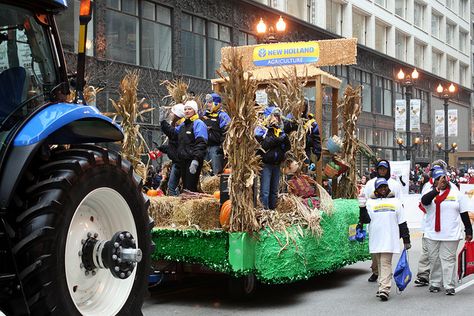 Case New Holland is our sponsor of the inflatables program of the McDonald's Thanksgiving Parade.  Pictured here is the New Holland Agriculture's "Fall Harvest Float."  Over 100 volunteers from Case New Holland participated in the parade, from riding on this float, handling our giant balloons, working in our green rooms, and much more.  This Chicagoland company truly embraces the parade and is a valued partner of the McDonald's Thanksgiving Parade. Thanksgiving Float Ideas, Fall Float, Parade Float Decorations, Homecoming Floats, New Holland Agriculture, Floating Decorations, Thanksgiving Parade, Fall Fest, Thanksgiving Day Parade