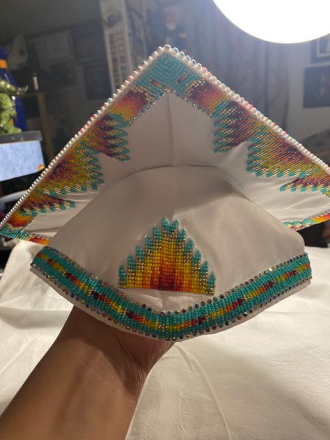 By Faith Bremner Indigenous Graduation Cap, Graduation Cap Beaded, Native American Graduation Cap, Anishinaabe Beadwork, Beaded Caps Graduation, Native American Graduation, Beaded Graduation Cap Native American, Native Graduation, Beaded Graduation Cap