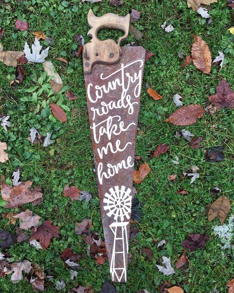 Country roads take me home 🚜 #byhand #country #countryroads #countryroadstakemehome #fauxcalligraphy #freehand #handmade #handpainted #handpaintedsaw #handlettering #handlettered #johndenver #maker #rustic #rusticdecor #saw #windmill Old Saw Blades Ideas Diy, Hand Saw Decor Diy Projects, Painted Handsaw, Windmill Blades Repurposed, Painting On Saw Blades Ideas, Saw Blades Repurposed, Old Saw Blades Ideas, Painted Saw Blades Ideas, Hand Saw Art Ideas