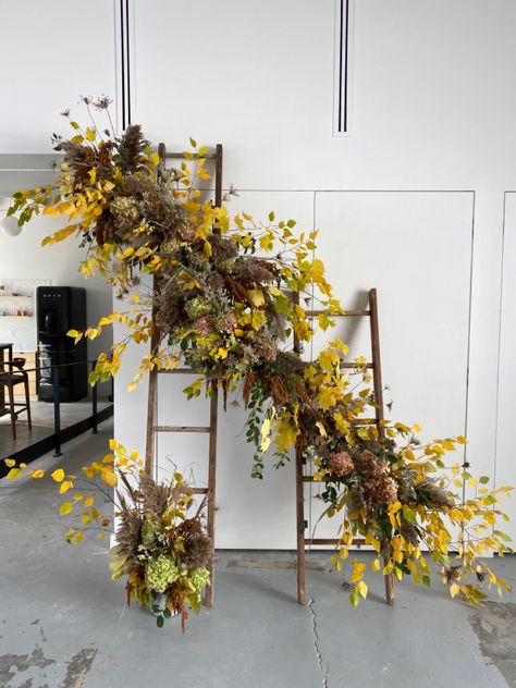 Ladder floral installation featuring foraged blooms and greens Ladder Floral Installation, Floral Ladder, Display Ladder, Floral Installation, Floral Installations, Floral Display, Boutonniere, Ladder Decor, Plants