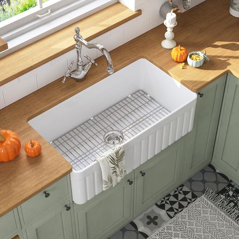 This DeerValley fireclay farmhouse apron kitchen sink is made with high-temperature firing, which gives it a dense structure and a solid texture. The most significant advantage of the dense structure is its non-porosity, which protects the kitchen sink from the infiltration of water and air, thus making the interior of the farmhouse kitchen sink clean and hygienic and less prone to yellowing. Then the sturdy texture makes the apron kitchen sink resistant to scratches and impacts, ensuring the longevity of this kitchen sink. And this kitchen sink is also equipped with a compatible basket drainer and sink grid, which not only facilitates daily use but also better protects the kitchen sink. What's more, this kitchen sink can be installed on both sides, so you can choose any side to install ac Clean Kitchen Sink, Fireclay Farmhouse Sink, Farmhouse Kitchen Sink, Farmhouse Apron, Kitchen Sink Stainless Steel, Apron Sink Kitchen, Apron Sink, Sink Grid, Farmhouse Aprons