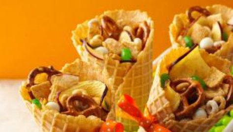 11 Uses for Ice Cream Cones That Have Nothing to Do With Ice Cream Ice Cream Cone Dessert Ideas, Ice Cream Cone Snacks, Ice Cream Cone Campfire Treats, Fruit Filled Ice Cream Cones, Ice Cream Cone With Sprinkles, S’mores In Ice Cream Cone, Fruit Cones, Treat Cones, Cereal Mix