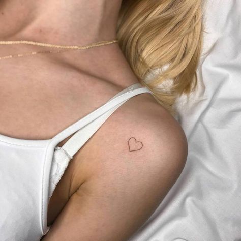 Heart Tattoo Under Collarbone, Upper Arm Heart Tattoo, Love Heart Tattoos For Women, Small Red Heart Tattoo On Chest, Small Heart Shoulder Tattoo, Heart Tattoo Small Arm, Heart Tattoo On Shoulder For Women, Tiny Heart Tattoo Shoulder, Minimalist Tattoo On Shoulder