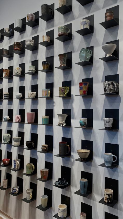 at the clay studio located in Philadelphia there is a variety of mugs and cups on display Wall Of Mugs, Ceramic Display Shelves, Tea Display Ideas Retail, Ceramic Exhibition Display, Cafe Merchandise Display, Ceramic Display Ideas, Vase Display Ideas, Mug Wall Display, Cup Display Ideas