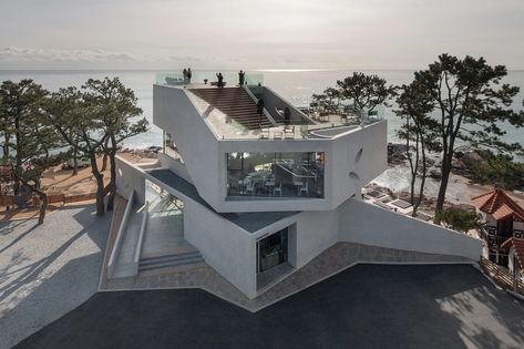 Angular concrete cafe frames stunning sea views in South Korea - Curbed Cities In Korea, Seaside Cafe, Funny Real Estate Quotes, Korean Cafe, Real Outfits, Funny Real Estate, Busan Korea, Concrete Architecture, Sacred Architecture