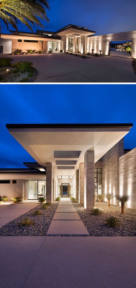 Setback from the road, the modern house has a covered entry with uplighting, and an oversized glass front door. #ModernHouse #Landscaping #Architecture Living On An Island, Architecture Homes, Desert House, Clerestory Windows, Living Modern, Luxury Garden, House Front Door, The Modern House, Desert Homes