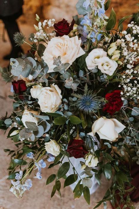 Blush Blue And Burgundy Wedding, Green Red And Blue Wedding, Blue Green Burgundy Wedding, Blue Red Green Wedding, Burgundy And Blue Wedding Flowers, Light Blue And Maroon Wedding, Blue And Red Winter Wedding, Dusty Blue And Wine Wedding, Thistle In Bouquet