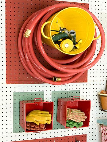 Attach metal buckets sideways to a garage wall for added storage. More DIY storage: http://www.bhg.com/decorating/do-it-yourself/accents/diy-storage-for-every-room/?socsrc=bhgpin091512wallbucketstorage=4 Garage Organization Cheap, Garden Hose Storage, Organized Garage, Garage Organization Tips, Cheap Organization, Garage Organizing, Organization Garage, Hose Storage, Garage Basement