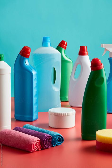 Composition of plastic bottles of cleaning utensils for kitchen and bathroom on bright red table over blue background. Cleaning Utensils, Detergent Bottles, Wardrobe Interior Design, Red Table, Football Design, Clean Kitchen, Ad Design, The Table, Plastic Bottles