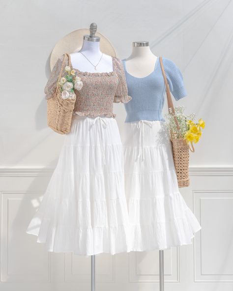 A summertime wardrobe staple, the Portofino is an airy midi skirt in tiered white cotton, with a smocked elastic waistline and a-line silhouette made for twirling! ✨ 🏷️ Cotton skirts, White cotton skirt for spring, Feminine and vintage style, Cottagecore style clothing, Romantic French-girl style #amantine #frenchgirl #frenchfashion #vintage #vintageinspired Cottagecore Girl, Cottagecore Skirt, White Cotton Skirt, Outfits Skirt, Cotton Skirts, Skirts White, French Girl Style, Cottagecore Style, Spring Skirts