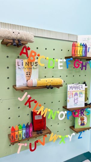 18K views · 2.6K reactions | One of my favorite spaces in my room, my pegboard! 😍🖍️  This summer I stumbled upon a YouTube video by @ystreetstudio showing her process of building a decorative pegboard. After watching the video, I immediately got the supplies and got to work on building this for my classroom! I filmed the entire process and plan on sharing that soon 🔨🪚   I decorated it for this month with my school supply plushes from @jellycat and back to school themed read alouds! It just screams Kindergarten to me and I love it! 😍 . . . #kindergarten #kindergartenclassroom #classroominspiration #classroomdisplay #classroomideas #diy #elementaryteacher #elementaryschool | Teach with Heath | Jackson 5 · ABC Pegboard Book Display, Teacher Pegboard, Hang Pegboard On Wall, Decorative Pegboard, Giant Pegboard Wall, Pegboard Shelves George & Willy, School Supply, In My Room, Read Alouds