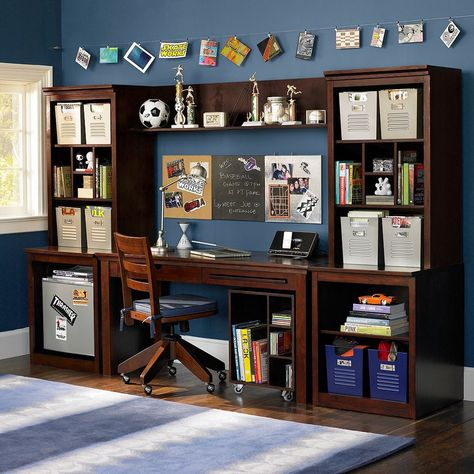 Not sure why there's a mini-fridge here (??) but what amazing storage space for books and supplies!  We love that there's room for the laptop and room to write.  source: PB teen Reka Bentuk Bilik Tidur, Teen Desk, Blue Painted Walls, Study Table Designs, Boys Room Design, Dark Blue Walls, Study Room Design, Table Office, Bedroom Desk