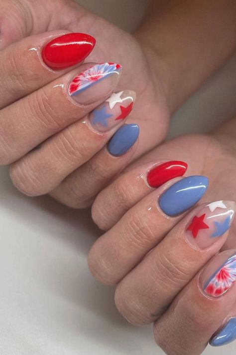 Celebrate the Fourth of July with a patriotic explosion of color on your nails. Featuring a glossy red, this set also includes a soft periwinkle blue and a clear base with a dynamic firework design along with solitary stars. These almond-shaped nails are a perfect tribute to Independence Day elegance. 🎆🇺🇸✨  // Photo Credit: Instagram @koridoesmynails July Fourth Nails, July 4th Nails, Firework Design, Blue Stiletto Nails, 4th Nails, Firework Nails, Oval Shaped Nails, Artistic Nails, Usa Nails