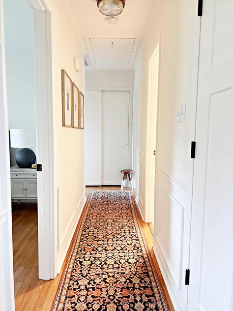 Transform your dark and narrow hallway with these inspiring decorating ideas! Discover clever trim tricks, pick the perfect paint color, how to transform old closet doors and space-saving tips to brighten and widen your home's corridors. Perfect for small spaces. Explore more now! End Of Narrow Hallway Ideas, Dark Painted Hallway, Small Dark Hallway Ideas, Dark Hallway Ideas Brighten, Long Hallway Decorating Narrow, Long Narrow Hallway Ideas, Narrow Hallway Decorating Ideas, Dark Hallway Ideas, Hallway Decorating Ideas