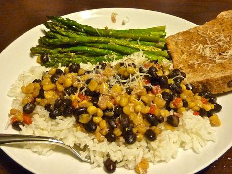 Yat's B&B recipe  2 tbsp butter 1 can sweet corn 1 tbsp brown sugar 1 can black beans, drained and rinsed 1/4 red pepper, diced 1/4 c un-sweetened/flavored almond milk 1/4 tsp cayenne pepper S&P A few splashes hot sauce  Melt butter in a lg pan over med heat. +corn and saute for ~10mins. +brown sugar, saute for about 2mins, stirring constantly. + black beans & red pepper, saute until warmed, ~2mins. +remaining ingredients. let simmer until sauce thickens, ~3mins. Enjoy! Canning Sweet Corn, Vegetarian Entrees, Autoimmune Protocol, Fun Foods, Cajun Recipes, No Calorie Foods, Canned Black Beans, Black Bean, Add Ons