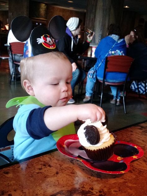 Little boy celebrating his first birthday at Disney by eating a Mickey cupcake. Birthday At Disney World, Birthday At Disney, Disney World Birthday, Trip To Disney World, Turning One, Disney World Trip, First Birthday, Disney World, Kids Birthday