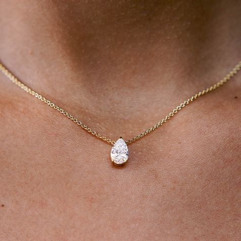 The ultimate timeless piece. A solitaire pear is centered between the collarbone on an 18k gold chain. The length of this necklace is 16" (40cm). Please get in touch if you would like a different chain length. Shape, color, and size of this pear diamond necklace are fully customizable as well. Diamond Solitaire Pendant Necklace, Pear Shaped Diamond Pendant Necklace, Pear Shaped Jewelry, Pear Diamond Necklace Designs, Engagement Necklace Jewelry, Pear Shape Necklace, Pear Pendant Necklace, Pear Shaped Necklace, Wedding Diamond Necklace