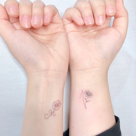 If matching couples' tattoos are a bit too much for you, scale it back with a simple letter of your partner's first name. Getting their initials inked is a