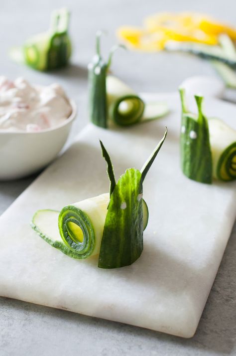 Cucumber Snails and Garden Vegetable Dip Healthy Snack Recipe for Kids by Handmade Charlotte | Pin Cheerfully Curated By #HandmadeCharlotte for #PeterRabbitMovie Dip Healthy, Healthy Snack Recipe, Vegetable Dip, Recipe For Kids, Decorações Com Comidas, Handmade Charlotte, Garden Vegetable, Vegetable Carving, Food Carving