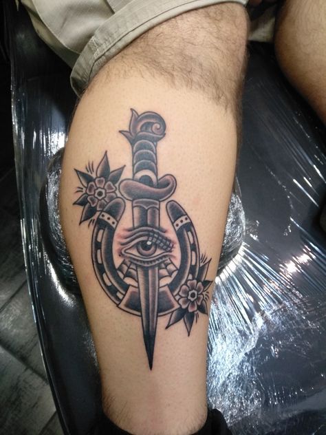 Traditional dagger,horseshoe,eye,flowers Traditional Good Luck Tattoo, American Traditional Horseshoe Tattoo Black, Horseshoe Traditional Tattoo, Traditional Horseshoe Tattoo, Old School Traditional Tattoo, Horseshoe Tattoo, Scroll Tattoos, Traditional Dagger, Old School Traditional