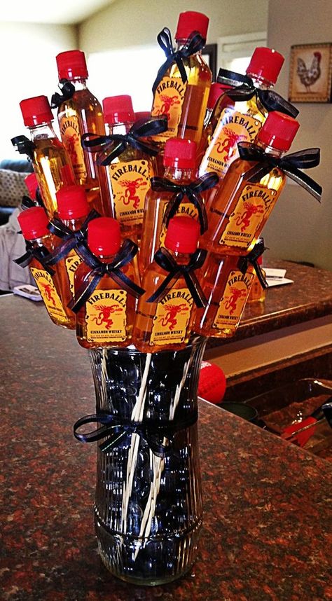 Booze-quet #valentines #broquet #valentinegifts #valentinesdaygiftsforhim #fathersday #fathersdaygifts #anniversarygiftideasforhim Fireball Mini Bottle Gift Ideas, Fireball Birthday Gift, Fireball Decor, Fireball Basket Gift Ideas, Fireball Gift Basket, Fireball Gift Ideas, Fireball Birthday, Liquor Baskets, Alcohol Basket