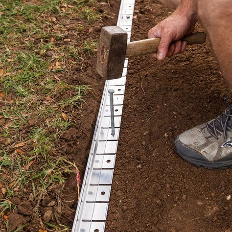 Paving alternative: How to make a gravel path | Better Homes and Gardens How To Make A Gravel Pathway, Edging For Gravel Pathway, Gravel And Paving Garden Ideas, Diy Paving Stones, Gravel Path Edging, Gravel Pathway Walkways, Wheelchair Accessible Garden Paths, Garden Paths And Walkways Cheap, Self Binding Gravel Path