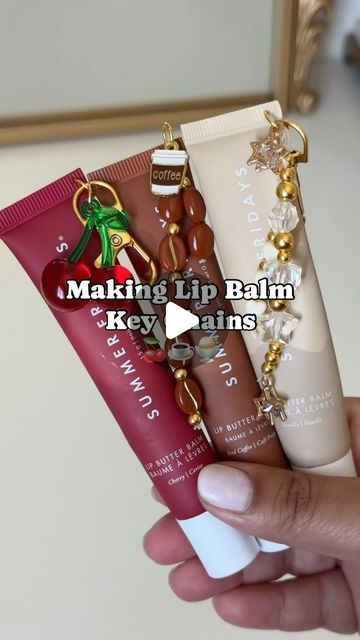 Aman on Instagram: "Making my favorite lip balms into key chains✨  @summerfridays   Which one is your favorite?   inspo: @j.xnah 🫶🏽 #lipbalm #summerfridays #lipbutter #lipbalmkeychain #diy" Lipgloss Holder Keychain Diy, Lip Balm Charms Diy, Chapstick Keychain Diy, Lip Balm Keychain Aesthetic, Diy Lip Gloss Keychain, Summer Fridays Lip Balm Keychain, Lipgloss Keychain Diy, Lipgloss Charms Diy, Lip Gloss Charm Diy