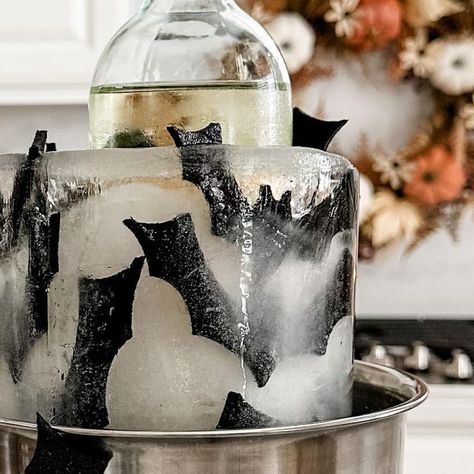 Malak Markopoulos on Instagram: "Halloween Ice Bucket 🦇 . If you’re hosting a Halloween party this year be sure to try this wine/champagne chiller idea 😍 . The mold is from Amazon (I’ll link in stories). I used felt bats that came with little adhesive dots🦇🦇 . I think it turned out perfect! . . . . . . . . . . . . . . . . . #halloweendiy #halloween #halloweendecorations #halloweendecor" Halloween Ice Bucket, Spooky Ice Cubes, Ice Molds Ideas, Halloween Champagne, Disco Skeleton, Felt Bats, Champagne Fountain, Food Party, Halloween Dinner