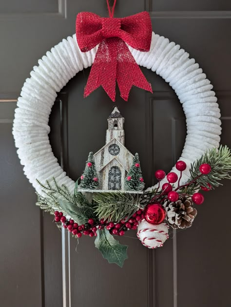 Styrofoam wreath, yarn red bow and garland decor and church Red White Wreath, Yarn Wreaths Christmas, Church Wreath, Styrofoam Wreath Ideas, Chunky Yarn Wreath, Christmas Wreath With Yarn, Snowman Yarn Wreath, White Yarn Wreath, Holiday Wreaths Diy Christmas