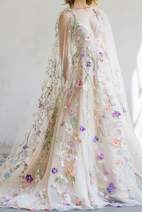 Do you dream of walking down the aisle like a storybook princess? These 10 fantasy wedding dresses bring magical designs to life. From celestial-inspired details to ethereal lace gowns, each dress is crafted to make your fairytale wedding a reality. Stunning silhouettes and intricate embellishments await. Find the perfect gown and make your dreams come true. Start your enchanting journey now! Dreamy Dress Fairy Tales, Fairy Wedding Gown, Pastel Wedding Dress, Watercolor Wedding Dress, Celestial Wedding Dress, Ethereal Gowns, Fairytale Bride, Fantasy Wedding Dress, Whimsical Wedding Dress